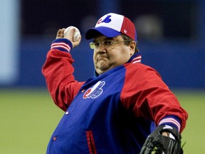 Montreal mayor Denis Coderre throws the first pitch during preseason Major League Baseball game between the New York Mets and the Toronto Blue Jays at the Olympic Stadium in Montreal on March 28, 2014.