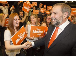 Federal NDP leader Thomas Mulcair shakes hands with supporters during an NDP rally in Montreal on May 8.
