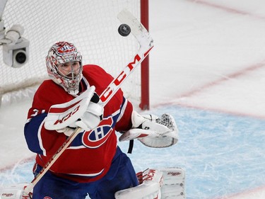 Montreal Canadiens goalie Carey Price knocks the puck to the ice during NHL semifinal action against the Tampa Bay Lightning at the Bell Centre in Montreal on Friday May 1, 2015.