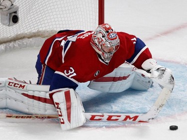 Montreal Canadiens goalie Carey Price makes a save against the Tampa Bay Lightning in overtime during NHL semifinal action at the Bell Centre in Montreal on Friday May 1, 2015.