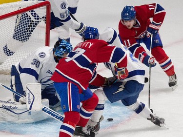 Montreal Canadiens right wing Brendan Gallagher, right, fails to get the puck past Tampa Bay Lightning goalie Ben Bishop as Montreal Canadiens left wing Max Pacioretty looks for the rebound during NHL semifinal action at the Bell Centre in Montreal on Friday May 1, 2015.