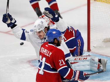 Tampa Bay Lightning centre Brian Boyle, centre, celebrates after Tampa Bay Lightning right wing Nikita Kucherov scored in double overtime to beat The Montreal Canadiens 2-1 during NHL semifinal action at the Bell Centre in Montreal on Friday May 1, 2015.