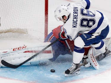 Tampa Bay Lightning right wing Nikita Kucherov crashes into Montreal Canadiens goalie Carey Price during NHL semifinal action at the Bell Centre in Montreal on Friday May 1, 2015. No goal was called on the play as Price was pushed across the goal line.