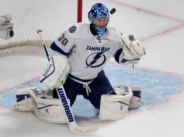 The puck sails past Tampa Bay Lightning goalie Ben Bishop's head as Montreal Canadiens left wing Max Pacioretty scores to tie the game in the final moments of the third period during NHL semifinal action at the Bell Centre in Montreal on Friday May 1, 2015.