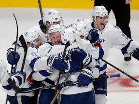 The Tampa Bay Lightning celebrate after Tampa Bay Lightning right wing Nikita Kucherov scored in double overtime to beat the Montreal Canadiens 2-1 during NHL semifinal action at the Bell Centre in Montreal on Friday May 1, 2015.