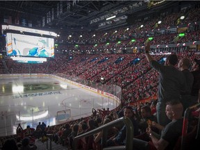 Montreal Canadiens fans watch Game 6 against the Tampa Bay Lightning on big screens at the Bell Centre on Tuesday, May 12, 2015.