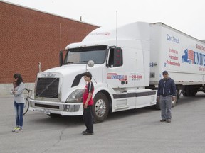 People stand in various blind spots of a truck  during a safety demonstration by Universal Driving School for the Montreal Gazette.  Instructors say that ideally, pedestrians and cyclists should stay about five metres from trucks and large vehicles,  and should avoid the areas around the engine compartment.