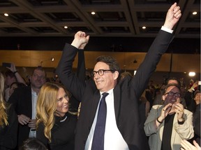 MONTREAL, QUE.: MAY 15, 2015 -- Newly elected PQ leader Pierre Karl Peladeau waves to crown next to his wife Julie Snyder, after he won the leadership on the first ballot in Quebec city on Friday May 15, 2015. (Pierre Obendrauf / MONTREAL GAZETTE)