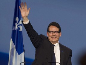 Pierre Karl Péladeau, waves to delegates prior to the vote count for the party leadership at the Palais des congres in Quebec City on Friday, May 15, 2015. Fifty weeks after winning that leadership, Péladeau announced today he was leaving politics.