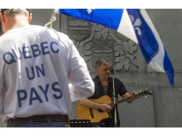 A small gathering amassed at the Wilfred Laurier statue in Dorchester Square in Montreal, on Monday, May 18, 2015 as part of the Fete des patriotes organized by the Saint-Jean-Baptiste Society. Denis Beaumont entertained the crowd before marching through the city streets.