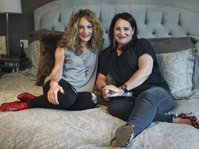 Lisa Brookman, right, and Liz Wiener, co-creators of the Wise Women Montreal blog, at Brookman's home in Dollard-des-Ormeaux west of Montreal on Wednesday May 20, 2015.  They both like to update the blog from the comfort of their beds.