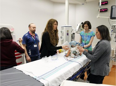 ER doctors, nurses and respiratory therapists take part in a simulation of a child having a seizure in a treatment room at the new Montreal Children's Hospital at the Glen Site in Montreal Thursday May 21, 2015 in preperation for this weekend's move of patients from the Tupper St. hospital.
