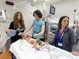 Doctors, nurses and respiratory therapists take part in a simulation of a child having a seizure in a treatment room at the new Montreal Children's Hospital at the Glen Site in preperation for this weekend's move of patients from the Tupper St. hospital.