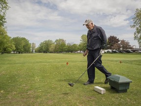 Ron Cumming prepares to tee off at the Club de Golf Municipal in Dorval  on Thursday. The Save Our Green Spaces organization is ramping up efforts to save the golf course from plans to build new security facilities for Trudeau Airport.