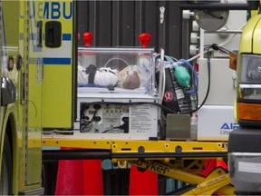 A baby in an incubator is brought to an ambulance at the Montreal Children's Hospital, Sunday May 24, 2015, during the move of the hospital to the MUHC Glen Campus.