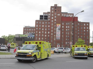 An ambulance leaves the Montreal Children's hospital with one of the first patients, during the move the the new site at the Glen Campus, Sunday May 24, 2015.  The first ambulances began leaving with patients just after 7 a.m.