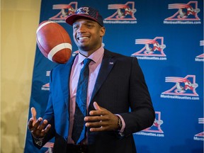 Defensive lineman Michael Sam poses for photo at his first Montreal news conference on May 26, 2015 after signing a two-year contract with the CFL team.