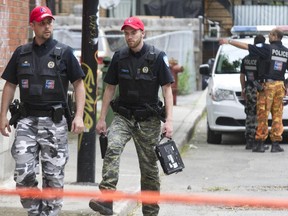 Montreal officers at the scene of a homicide  on Robillard St. in Montreal May 28, 2015.