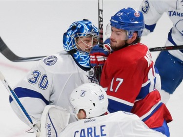 Montreal Canadiens centre Torrey Mitchell, right, collides with Tampa Bay Lightning goalie Ben Bishop, left, during the third period of game two of their NHL eastern conference semi-final hockey series at the Bell Centre in Montreal on Sunday, May 3, 2015.