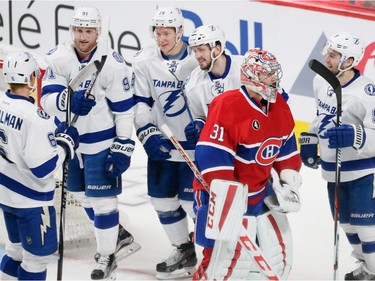 Canadiens goalie Carey Price, second form right, skates past Tampa Bay Lightning right wing Nikita Kucherov, third from right, and teammates after he scored a goal during the third period of game two of their NHL eastern conference semi-final hockey series at the Bell Centre in Montreal on Sunday, May 3, 2015.