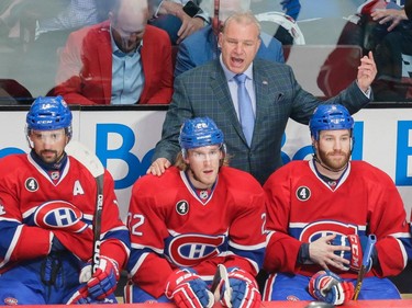 Canadiens head coach Michel Therrien, rear, yells at players during the first period of game two of their NHL eastern conference semi-final hockey series against the Tampa Bay Lightning at the Bell Centre in Montreal on Sunday, May 3, 2015.