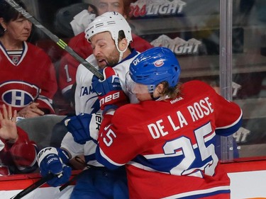 Canadiens left wing Jacob De La Rose, right, collides with Tampa Bay Lightning left wing Brenden Morrow, left, during the first period of game two of their NHL eastern conference semi-final hockey series at the Bell Centre in Montreal on Sunday, May 3, 2015.