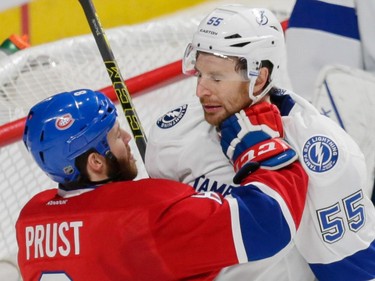 Canadiens right wing Brandon Prust, left, hits Tampa Bay Lightning defenseman Braydon Coburn, right, during the first period of game two of their NHL eastern conference semi-final hockey series at the Bell Centre in Montreal on Sunday, May 3, 2015.