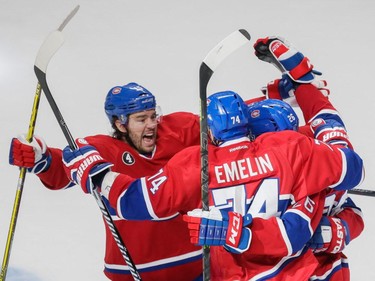 Canadiens right wing P.A. Parenteau, left, celebrates the goal of Canadiens defenseman Jeff Petry, left, along with teammate Alexei Emelin, centre, during the first period of game two of their NHL eastern conference semi-final hockey series against the Tampa Bay Lightning at the Bell Centre in Montreal on Sunday, May 3, 2015.