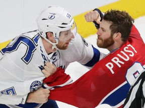 The Canadiens' Brandon Prust exchanges punches with Tampa Bay Lightning's Braydon Coburn during the third period of Game 2 of their Eastern Conference semifinal series at the Bell Centre on May 3, 2015. The Lightning won the game 6-2 to take a 2-0 series lead.