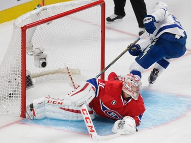 Tampa Bay Lightning center Steven Stamkos, right, scores on Montreal Canadiens goalie Carey Price, left, during the second period of game two of their NHL eastern conference semi-final hockey series at the Bell Centre in Montreal on Sunday, May 3, 2015.
