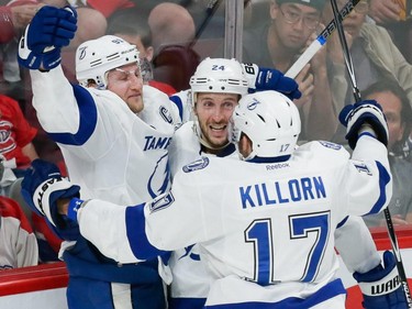 Tampa Bay Lightning center Steven Stamkos, left, celebrates his goal against the Montreal Canadiens with teammates Ryan Callahan, centre, and Alex Killorn, right, during the second period of game two of their NHL eastern conference semi-final hockey series at the Bell Centre in Montreal on Sunday, May 3, 2015.