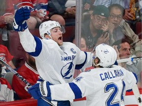 The Tampa Bay Lightning's Steven Stamkos, left, celebrates with teammate Ryan Callahan after scoring against the Canadiens during Game 2 of Eastern Conference semifinal series at the Bell Centre on May 3, 2015. The Lightning won 6-2.