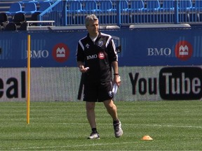 Montreal Impact coach Frank Klopas watches players during practice at Saputo Stadium in Montreal on May 5, 2015.