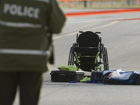 A wheelchair sits on rue Yves-Blais in Terrebonne May 7, 2015, after the man in it was fatally shot Wednesday night.