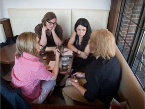 File photo: Montreal Gazette reporter Marian Scott, left, Mary Foster with Solidarity Across Borders and law student Karen Tolosa, who is with a collective called Éducation Sans Frontières, listen to Guadalupe, the mother of a boy who was deported to Mexico after his school alerted immigration authorities about his whereabouts.