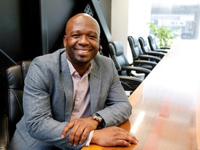 Frantz Saintellemy in his office in Montreal on Thursday May 7, 2015. Saintellemy has become the centre of a nest of companies run largely by entrepreneurs from the local Haitian community that he's rallied together in a building in the much-maligned St. Michel district.