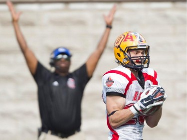 Doug Corby of Queen's University and Team East goes in for a touchdown after catching a pass for the 50-yard score in the 4th quarter during the CIS East-West Bowl at Percival Molson stadium in Montreal Saturday, May 9, 2015.