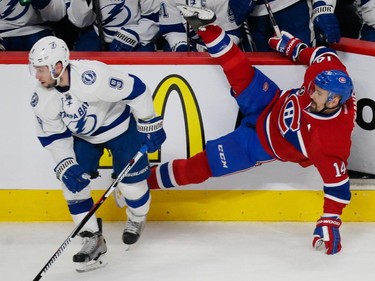 MONTREAL, QUE.: MAY 9, 2015 -- Montreal Canadiens centre Tomas Plekanec, right, falls after colliding against Tampa Bay Lightning centre Tyler Johnson, left, during the first period of game five of their NHL Eastern Conference semifinal series at the Bell Centre in Montreal on Saturday, May 9, 2015. (Dario Ayala / Montreal Gazette)