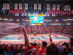 Montreal fans cheer as the Canadiens go on the ice before the start of Game 5 of their NHL Eastern Conference semifinal series against the Tampa Bay Lightning at the Bell Centre on May 9, 2015.