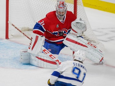 Montreal Canadiens goalie Carey Price, top, makes a save against Tampa Bay Lightning centre Steven Stamkos, bottom, during the first period of game five of their NHL Eastern Conference semifinal series at the Bell Centre in Montreal on Saturday, May 9, 2015.