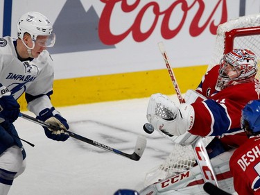 MONTREAL, QUE.: MAY 9, 2015--  Montreal Canadiens goalie Carey Price strains to get a loose puck as Tampa Bay Lightning center Brian Boyle looks for rebound during NHL Eastern Conference semifinal action in Montreal on Saturday May 9, 2015.  (Allen McInnis / MONTREAL GAZETTE)