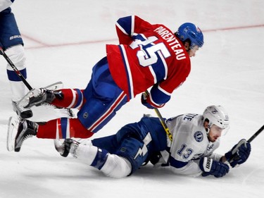 MONTREAL, QUE.: MAY 9, 2015--  Montreal Canadiens right wing P.A. Parenteau gets tripped up with Tampa Bay Lightning center Cedric Paquette during NHL Eastern Conference semifinal action in Montreal on Saturday May 9, 2015.  (Allen McInnis / MONTREAL GAZETTE)