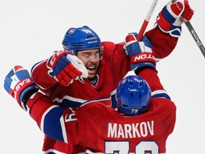 The Canadiens' P.A. Parenteau celebrates his game-winning goal against the Tampa Bay Lightning with teammate Andrei Markov during the third period of Game 5 of their NHL Eastern Conference semifinal series at the Bell Centre in Montreal on May 9, 2015.
