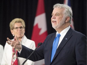 Ontario Premier Kathleen Wynne, left, and Quebec Premier Philippe Couillard hold a media availability after meeting in Toronto on Monday May 11, 2015.