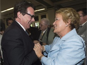 Pierre Karl Péladeau, new elected leader of the Parti Québécois Pierre Karl Peladeau, is greeted by former leader Pauline Marois during a gala dinner on National Patriots' Day in Montreal, Monday, May 18, 2015. Marois's expenses since leaving office in 2014 have reached $129,276.