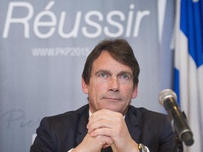 Parti Quebecois leadership candidate Pierre Karl Peladeau speaks during a news conference in Montreal, Tuesday, March 10, 2015, where he launched his economic policy.