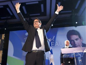 Parti Quebecois newly elected leader Pierre-Karl Peladeau waves as leadership vote results were announced in Quebec City Friday, May 15, 2015.