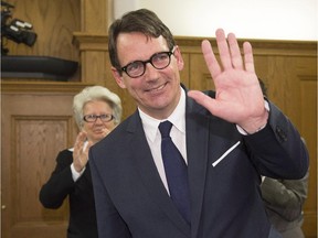 Pierre Karl Peladeau (left) enters a party caucus meeting for the first time since his election as leader, in Quebec City, Tuesday, May 19, 2015.THE CANADIAN PRESS/Jacques Boissinot