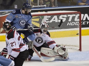 Rimouski Oceanics' Frédérik Gauthier watches the puck enter Quebec Remparts' Zachary Fucale's net during second period action Wednesday, May 27, 2015 at the Memorial Cup in Quebec City.
