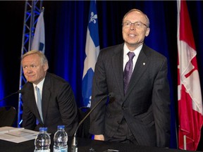 SNC-Lavalin chief executive Robert Card, right, and Chairman Lawrence Stevenson get ready to start the company's annual meeting Thursday, May 7, 2015 in Montreal.
